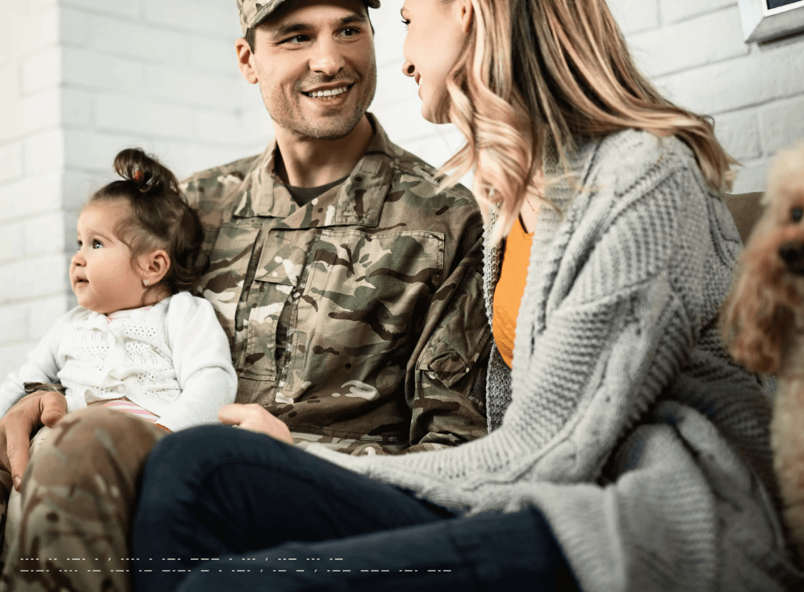 Veteran with baby and woman representing family