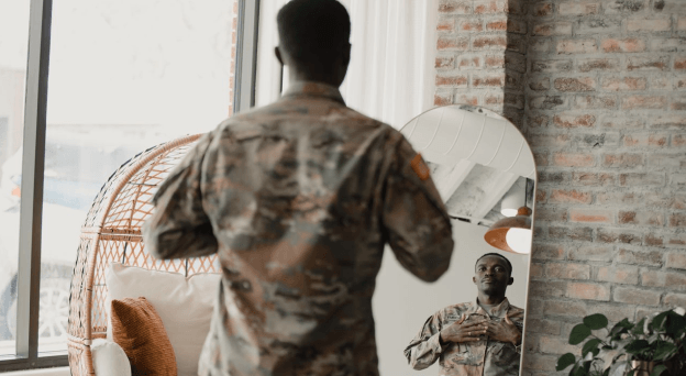 Veteran looking at himself in a mirror