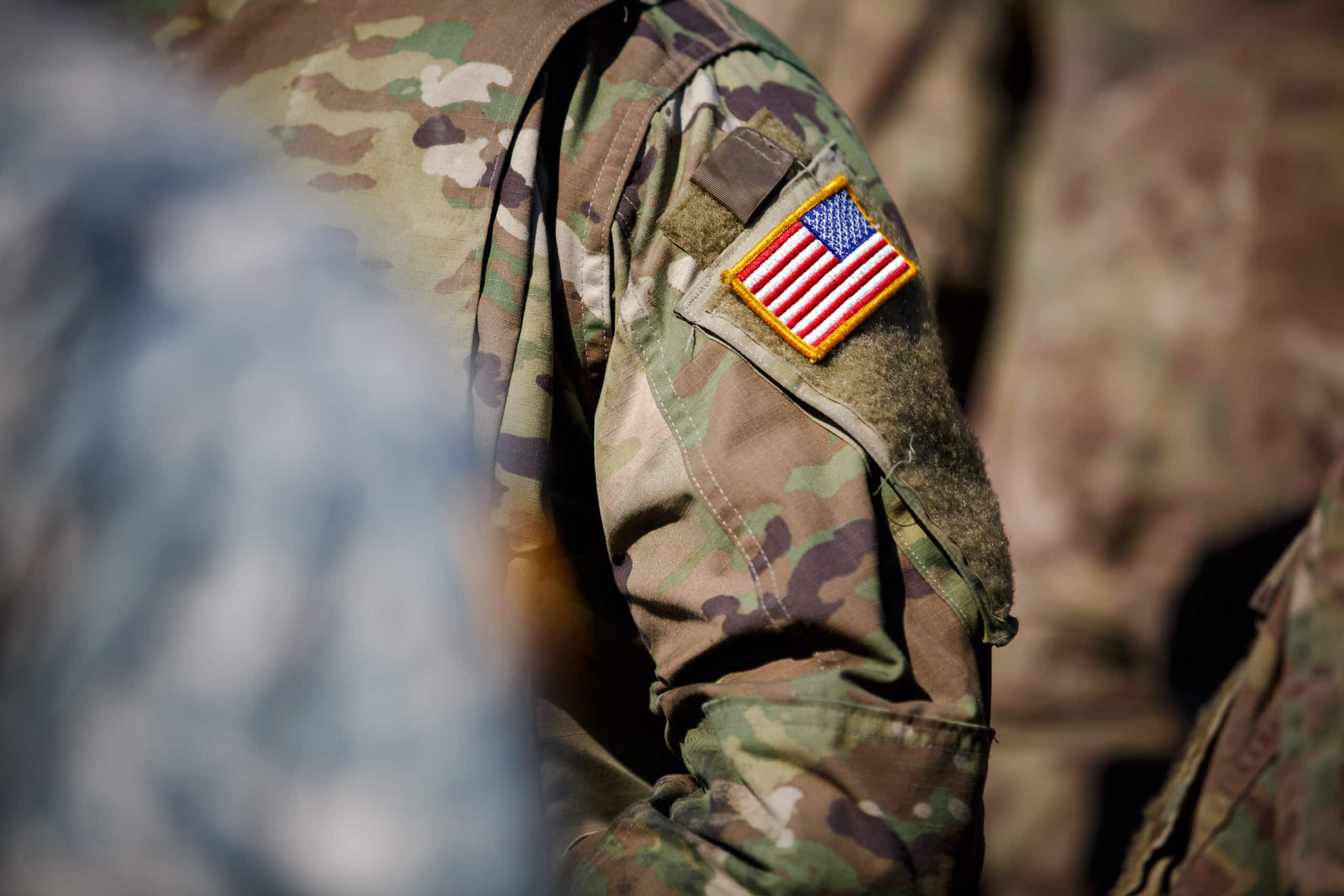 USA flag and US Army patch on solder's uniform