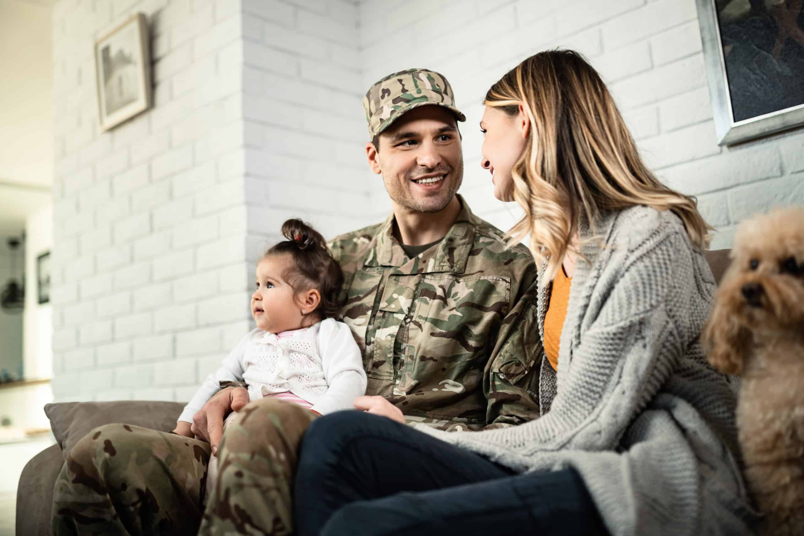 Happy military family reuniting at home.