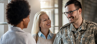 Soldier in a conversation with two women