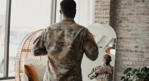 Veteran looking at himself in a mirror