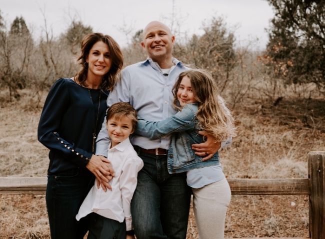 Military family standing together outdoors